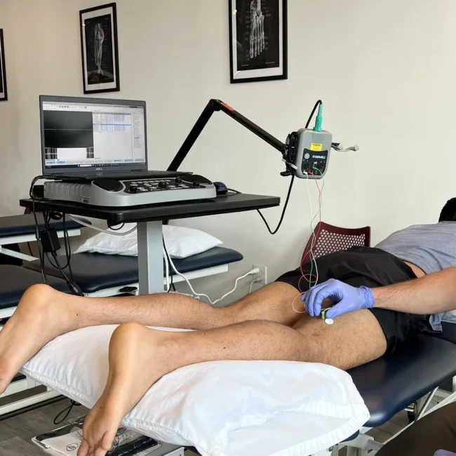 EMG testing procedure on patient leg at neuromuscular diagnostics Chicago